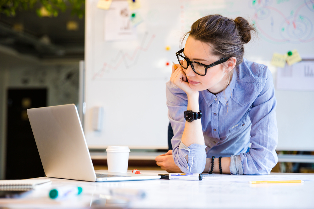 Businesswoman focused on her laptop screen 