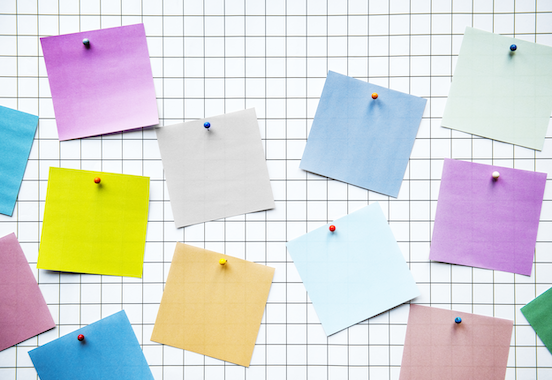 Colorful sticky notes on a board