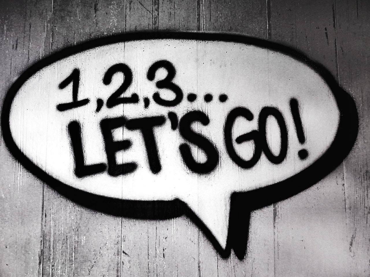 Black and white speech bubble with writing that says 1,2,3...Let's Go!