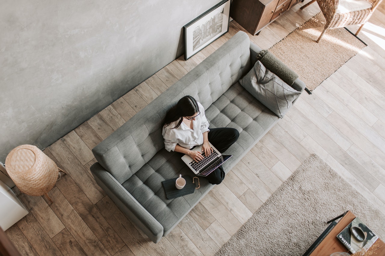 Woman working from home on her couch