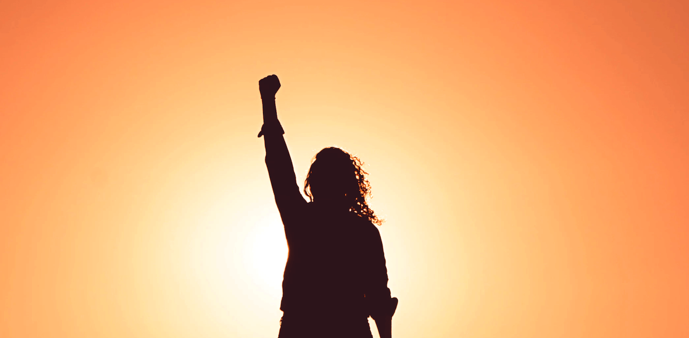 Person with their fist in the air in celebration