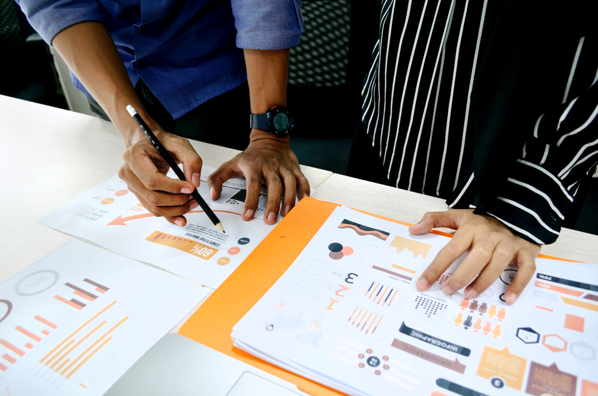 two people collaborating on research findings